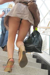 Upskirt at the mall. Gorgeous blonde is hot